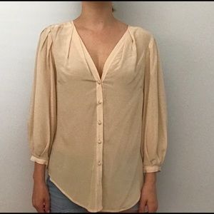 Cream colored silk blouse
